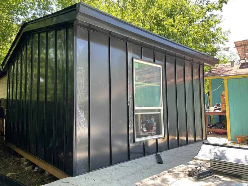 Black standing seam metal wall panels for Roof Inspection in Cudahy