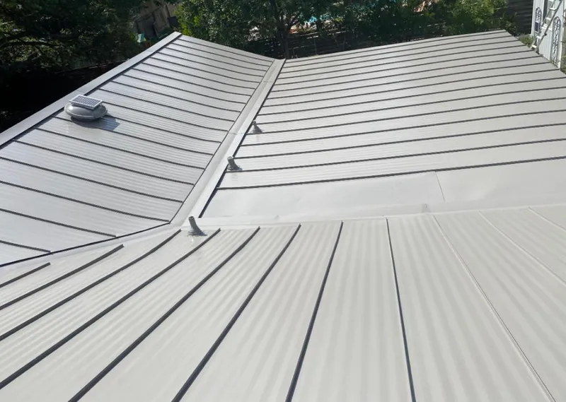 Solar attic fan installed on a metal roof for Roof Ventilation in Cudahy